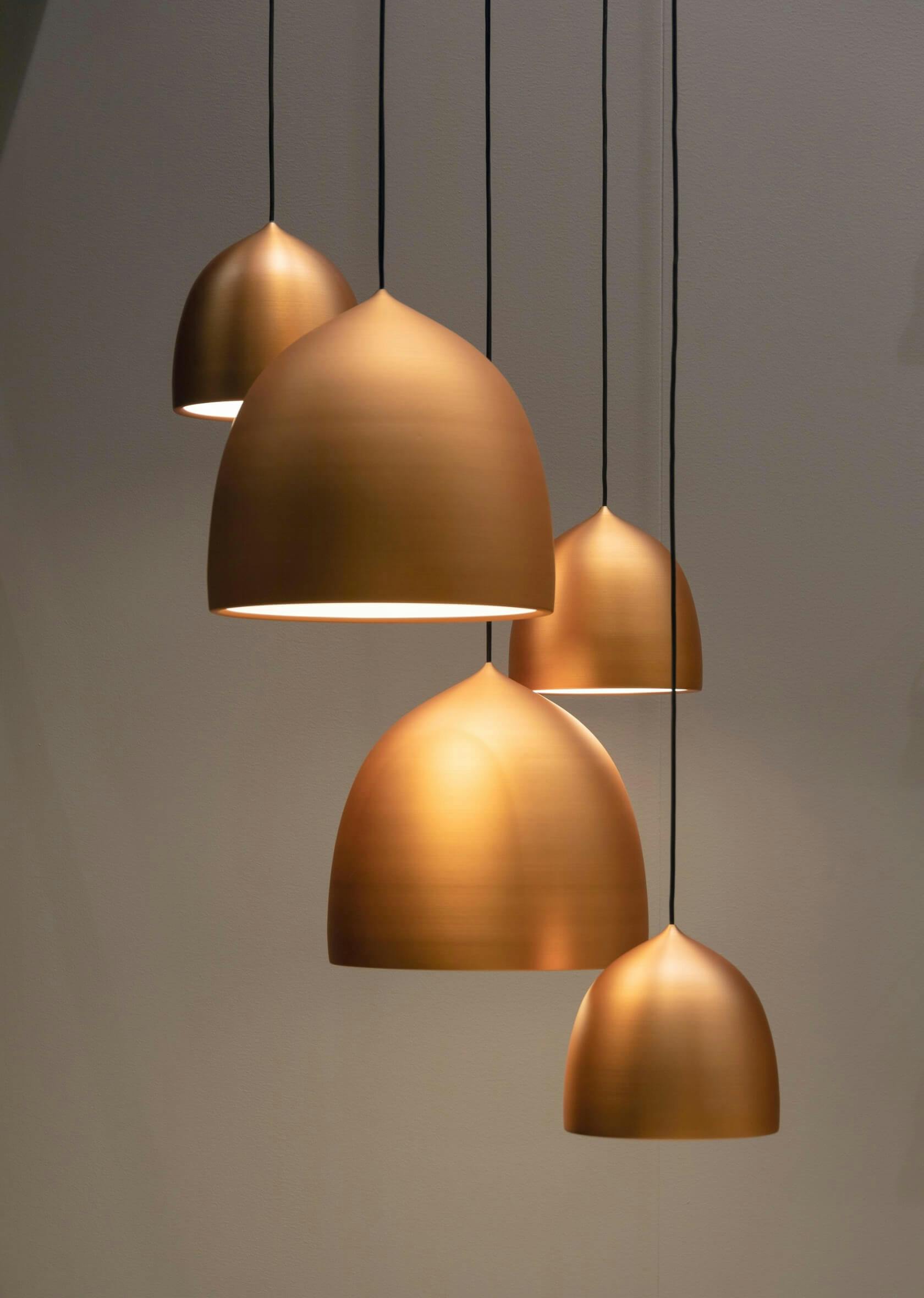 Pendant lights with bronze finish hanging from the ceiling