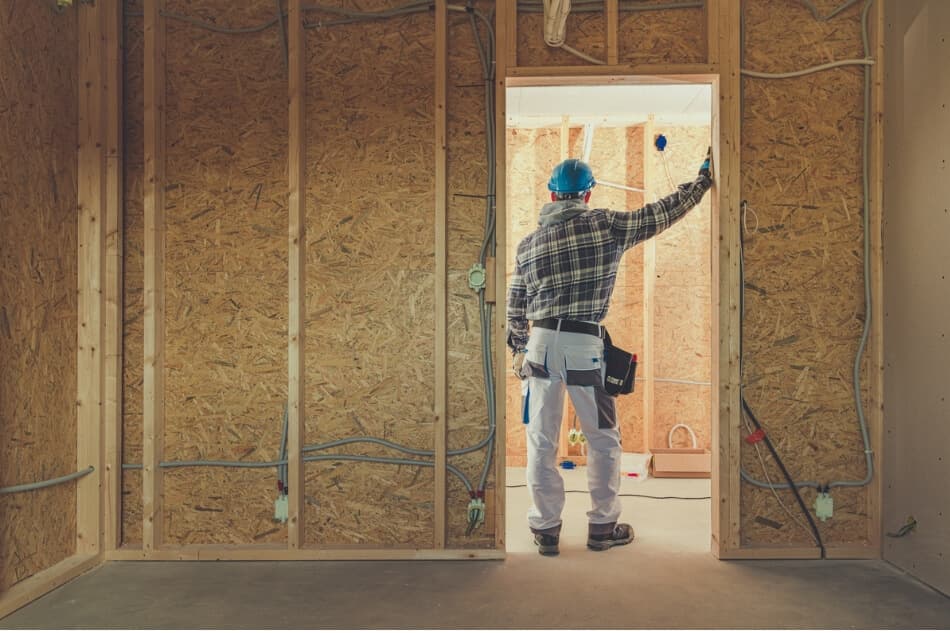 Electrician surveys unfinished work environment