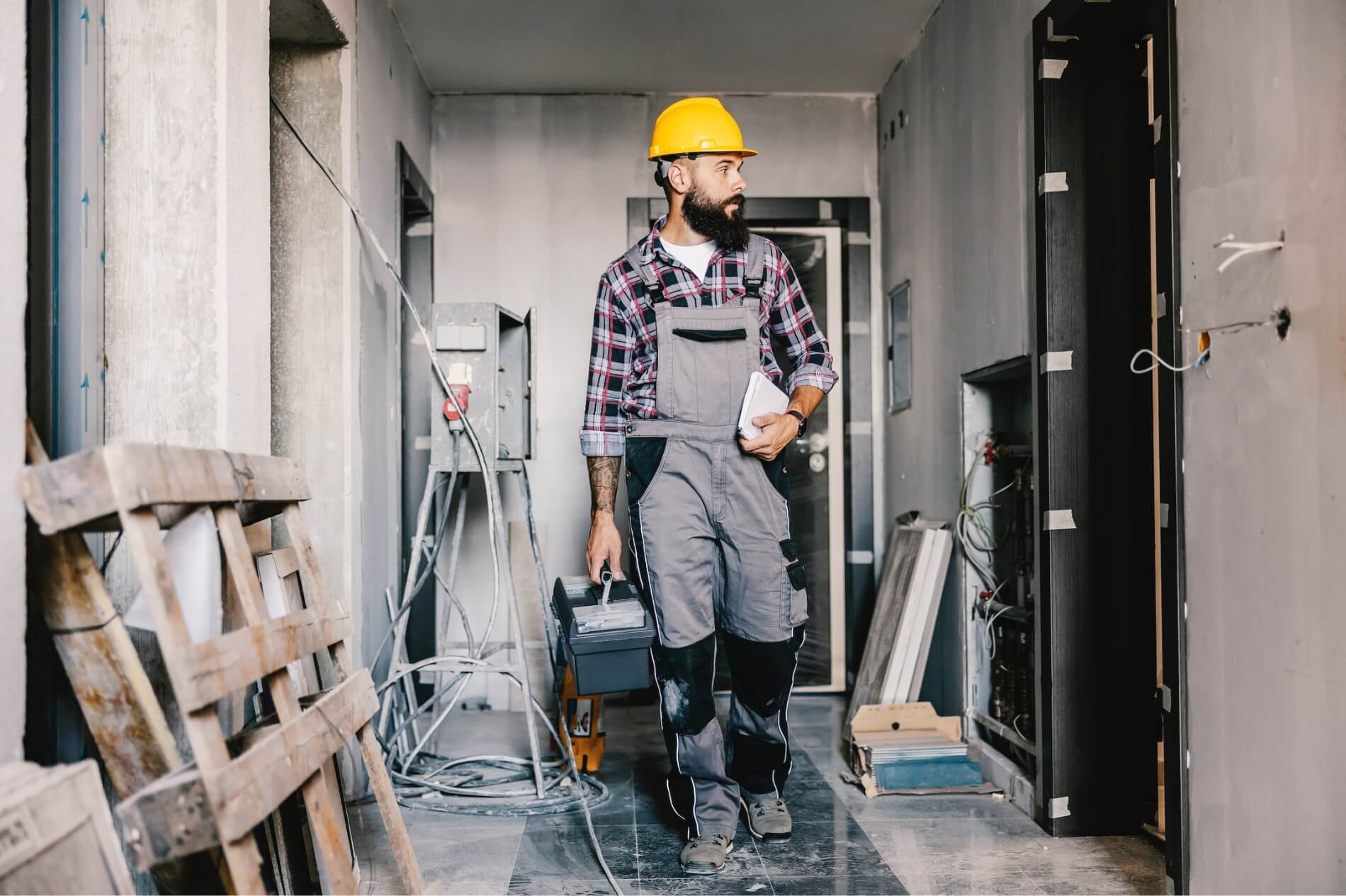 Electrical inspector begins to survey unfinished basement