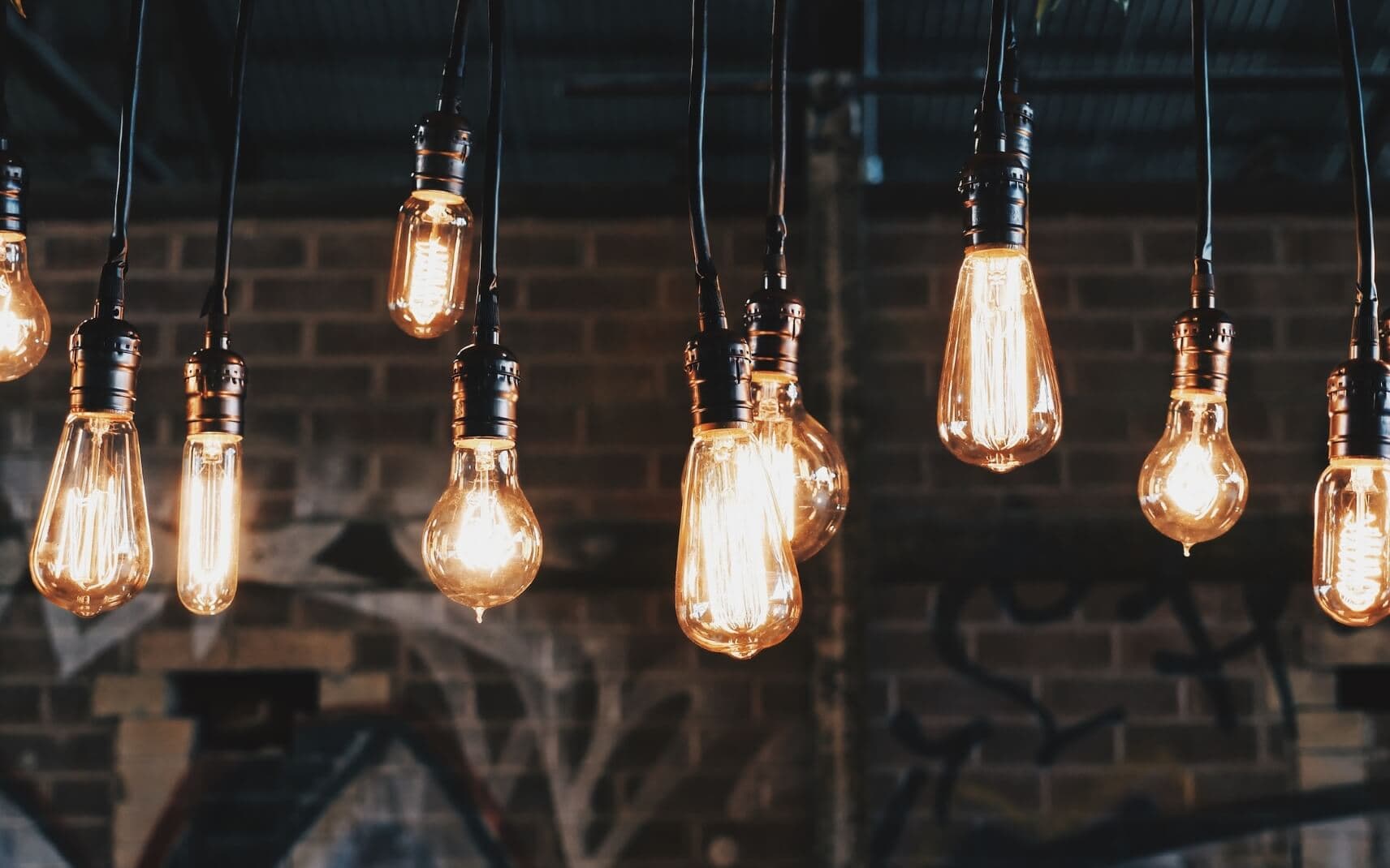 Lightbulbs hanging from ceiling of newly renovated city home